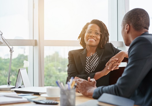 An adviser speaks to a client and answers questions about the Old Mutual Pensions Trust.