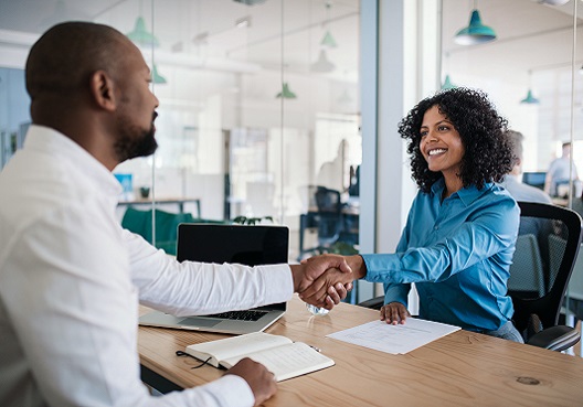 A qualified financial adviser walks a client through the Mvest Personal Pension plan at his office.
